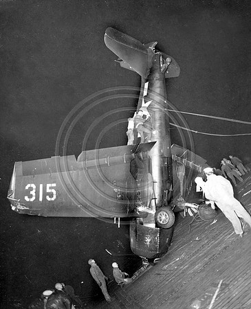 F-6-F Hellcat Being righted after crashlanding