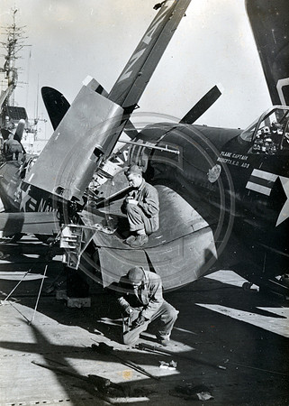 Mechanis working on a fighter