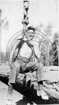 EK hangin' from logging equipment circa 1928