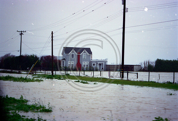 A Victorian home encircled by flood waters in Ferndale
