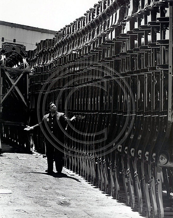 Comedian Jackie Gleason posing at Buick Auto Plant