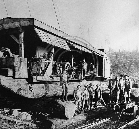 Crew posing next to a Giant Steam Donkey